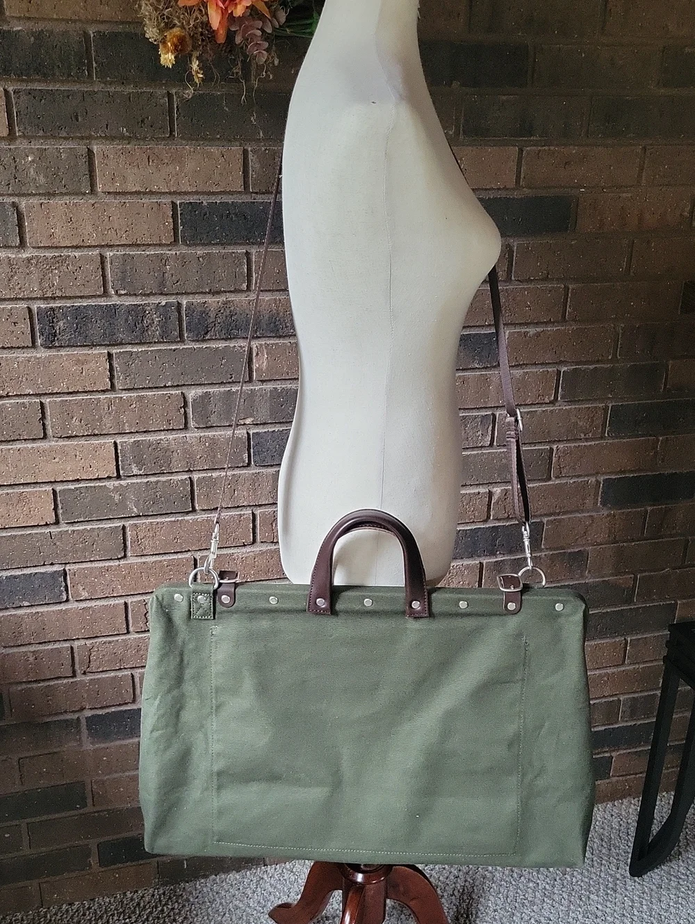 Line of Trade green military duffle sack with brown canvas strap